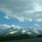 Roadside view of clouds and the Rocky Mountains - Colorado Pest Management