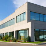 Corner view of a grey office building - Colorado Pest Management