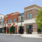 A series of retail buildings in a strip mall - Colorado Pest Management