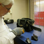 Colorado Pest Management technician working at blue table