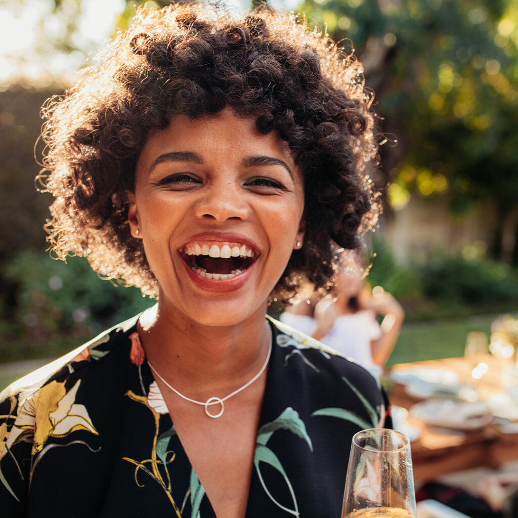 young woman happilyl enjoying time outside