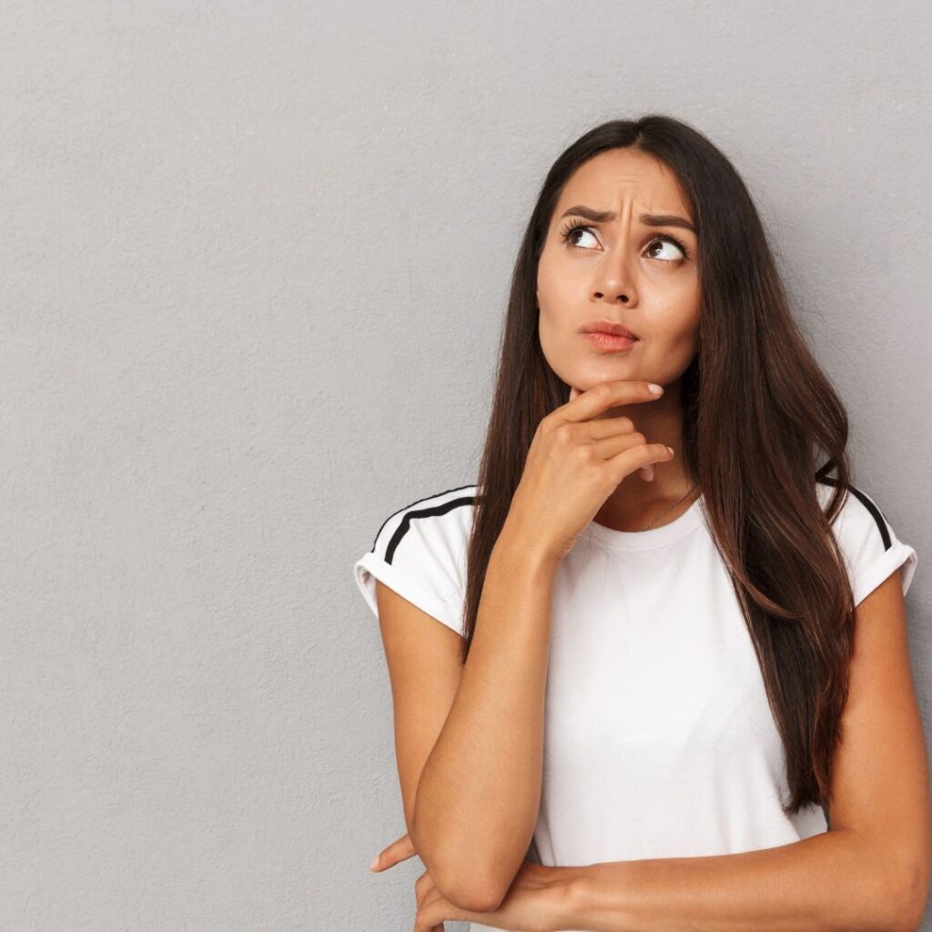 woman listening to wall