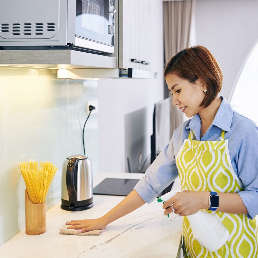 woman cleaning kitchen
