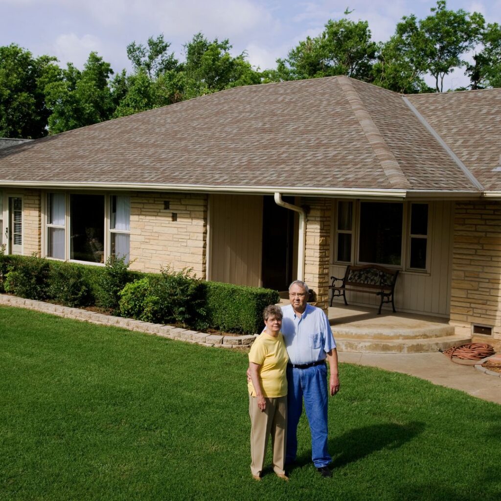 older couple outside their home