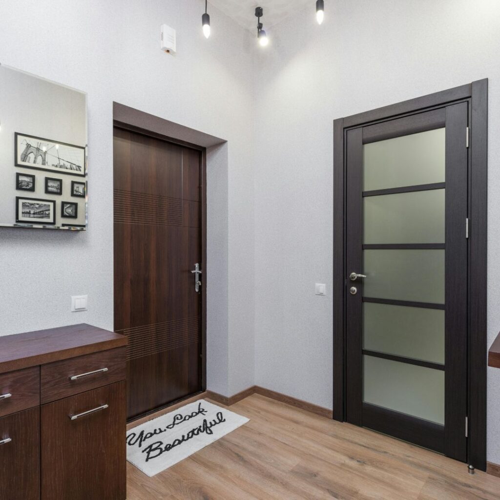 a foyer with door cracks to the closet and entryway