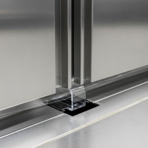 Door sweep being installed on a commercial kitchen door